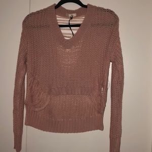 Cute light pink, ripped, cropped sweater.